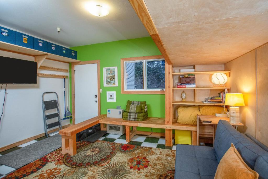 a living room with a couch and a table at Alyeska North #400 in Girdwood