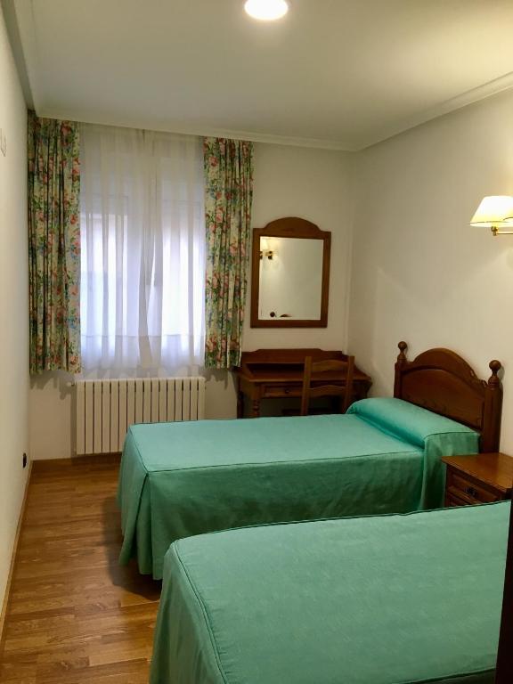 Postel nebo postele na pokoji v ubytování Viviendas de Uso Turístico Abedul