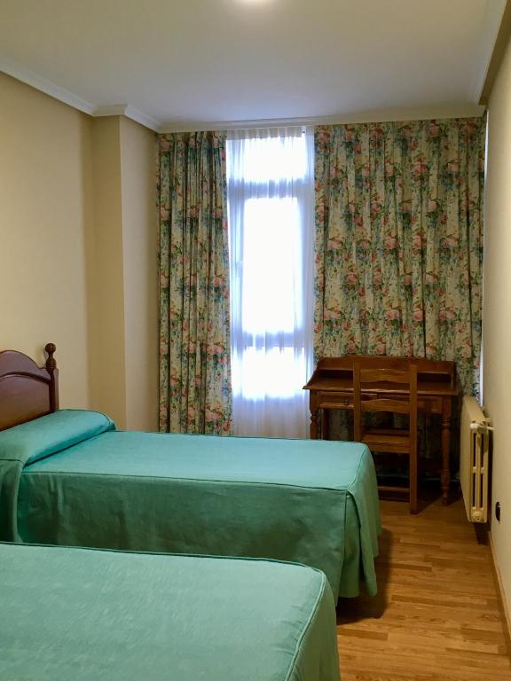 Postel nebo postele na pokoji v ubytování Viviendas de Uso Turístico Abedul