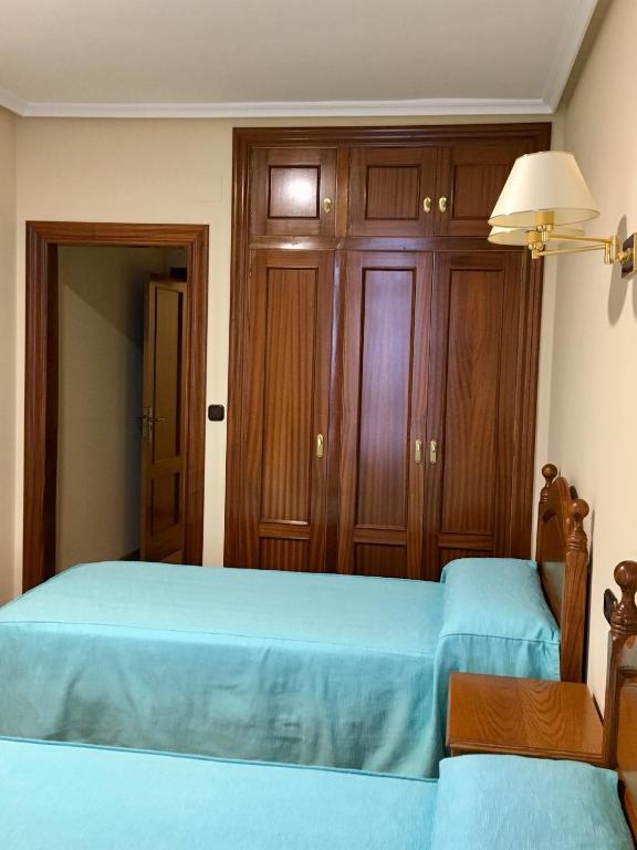 Postel nebo postele na pokoji v ubytování Viviendas de Uso Turístico Abedul