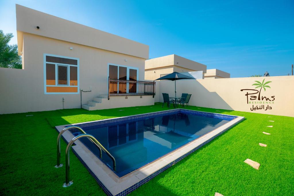 Bazén v ubytování Palms Residence Inn دار النخيل nebo v jeho okolí