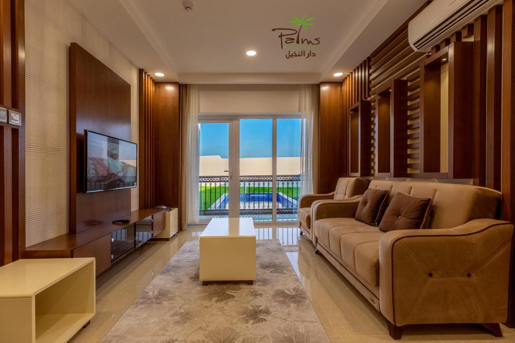 Posezení v ubytování Palms Residence Inn دار النخيل