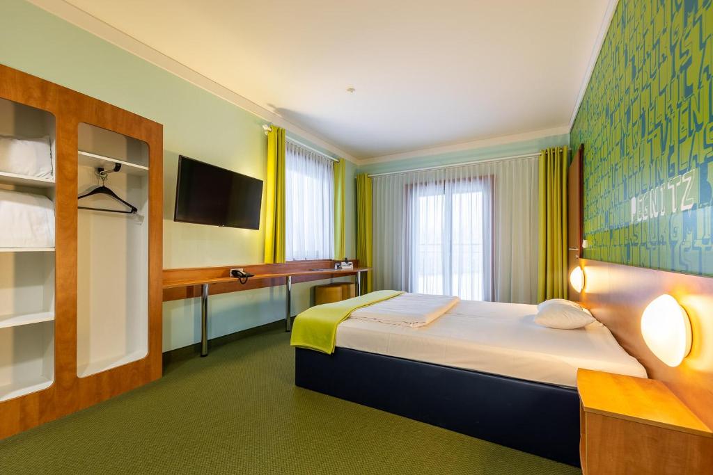 Postel nebo postele na pokoji v ubytování Hotel Fränkische Schweiz-Pegnitz