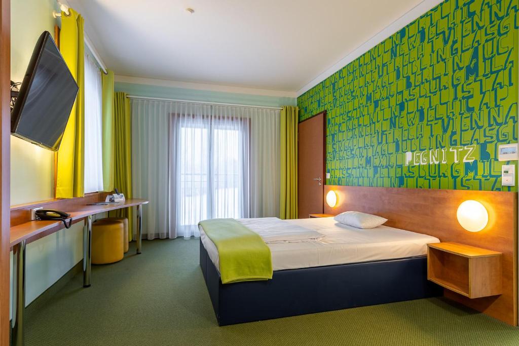 Postel nebo postele na pokoji v ubytování Hotel Fränkische Schweiz-Pegnitz