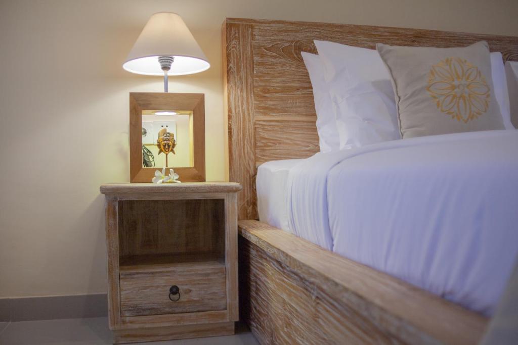 Postel nebo postele na pokoji v ubytování Sujiwa Ubud Retreat Villa