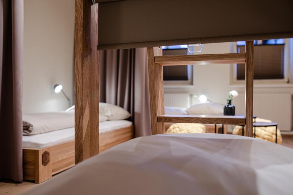 Postel nebo postele na pokoji v ubytování Roomie Alps Design Hostel
