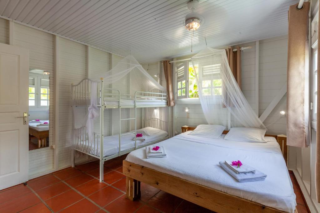Postel nebo postele na pokoji v ubytování Villa Vue Sauvage