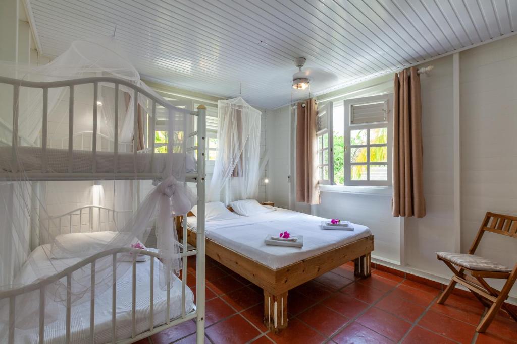 Postel nebo postele na pokoji v ubytování Villa Vue Sauvage