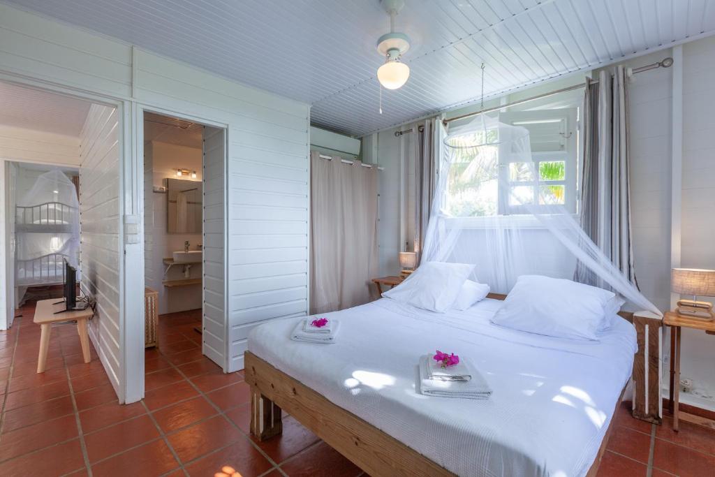 Postel nebo postele na pokoji v ubytování Villa Vue Sauvage