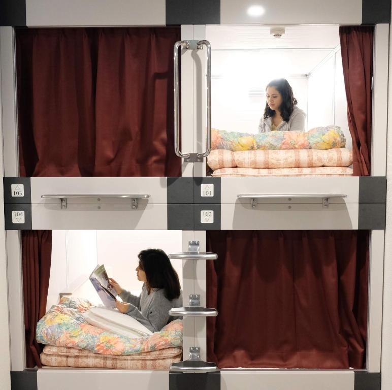 Postel nebo postele na pokoji v ubytování 大田市ゲストハウス 雪見院 Guesthouse Yukimi-inn