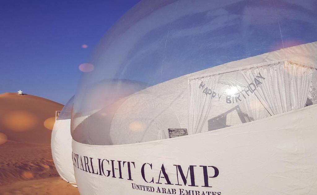 a close up of the front end of a white airplane at STARLIGHT CAMP in Dubai