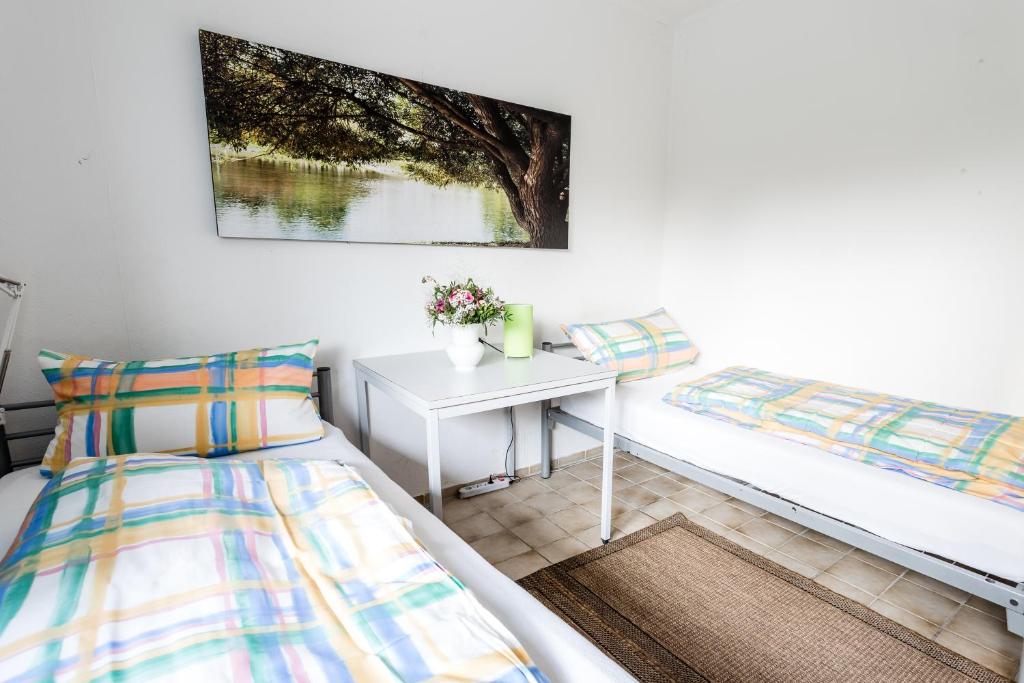 Postel nebo postele na pokoji v ubytování Elbdeichkoje de Monteure & Urlauber