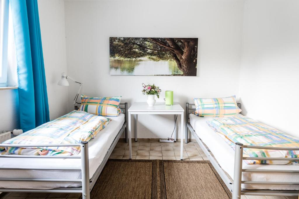 Postel nebo postele na pokoji v ubytování Elbdeichkoje de Monteure & Urlauber