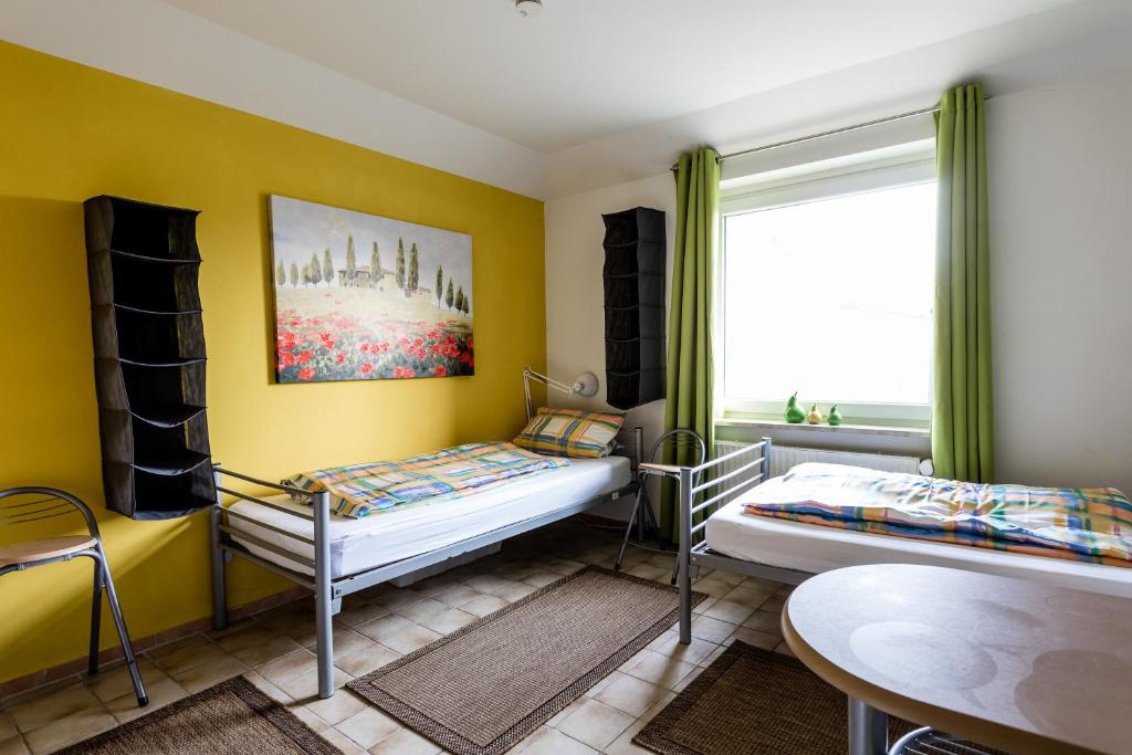 Postel nebo postele na pokoji v ubytování Elbdeichkoje de Monteure & Urlauber
