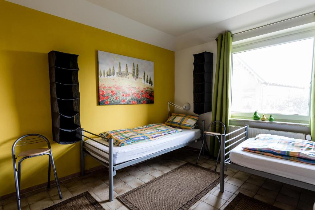 Postel nebo postele na pokoji v ubytování Elbdeichkoje de Monteure & Urlauber