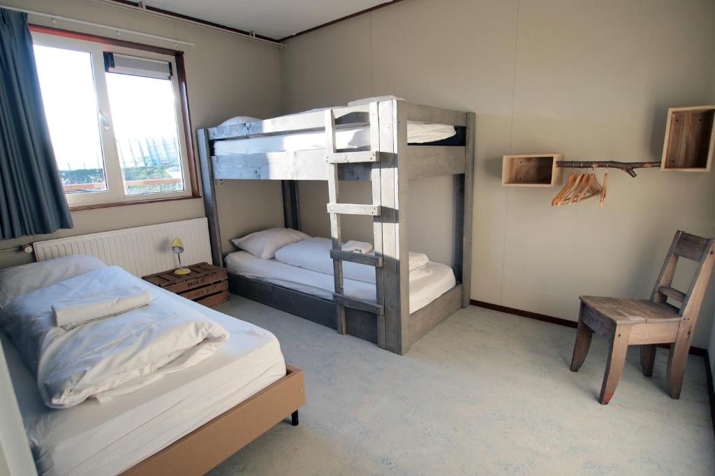 Postel nebo postele na pokoji v ubytování Amsterdam Farm Lodge