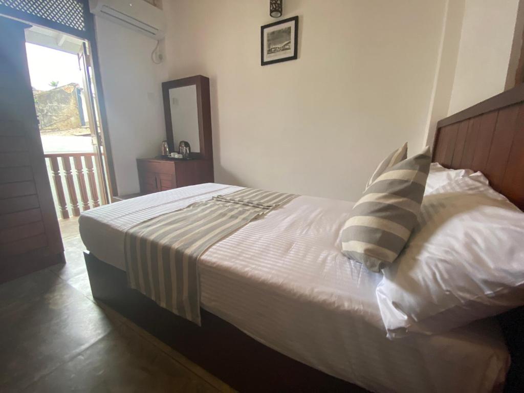Postel nebo postele na pokoji v ubytování Arches Fort