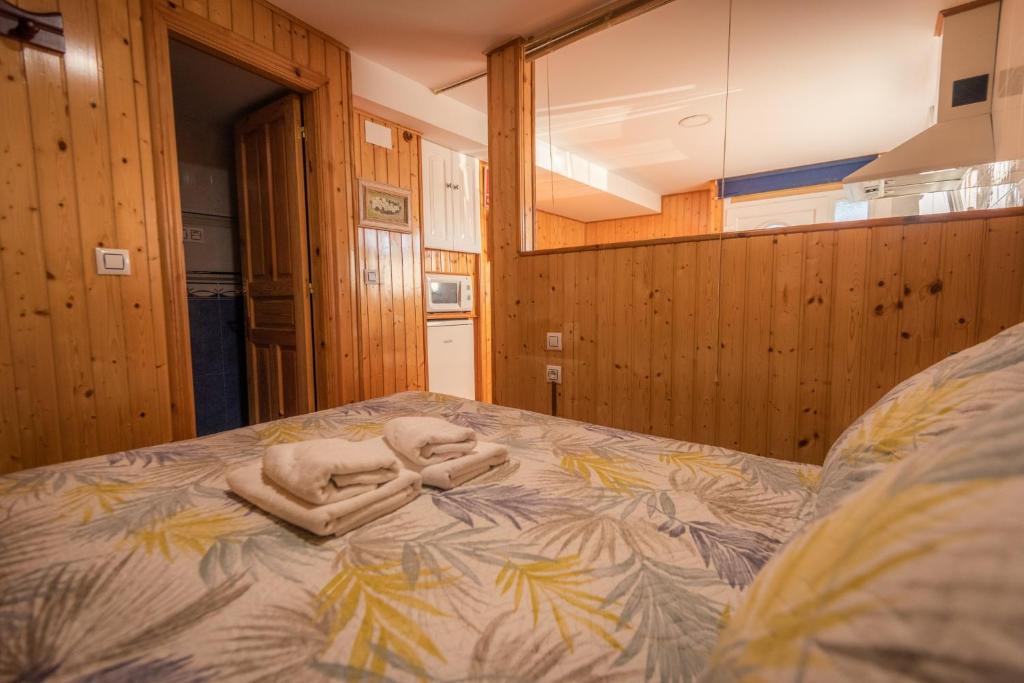 Cama o camas de una habitación en Apartamentos Cudillero