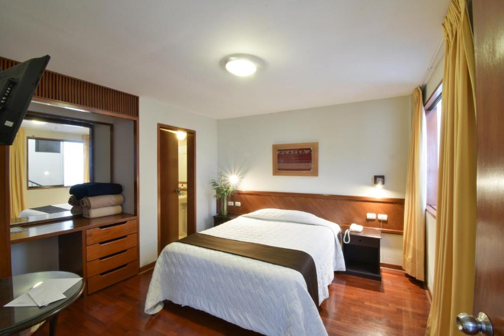 Postel nebo postele na pokoji v ubytování Hotel Señorial