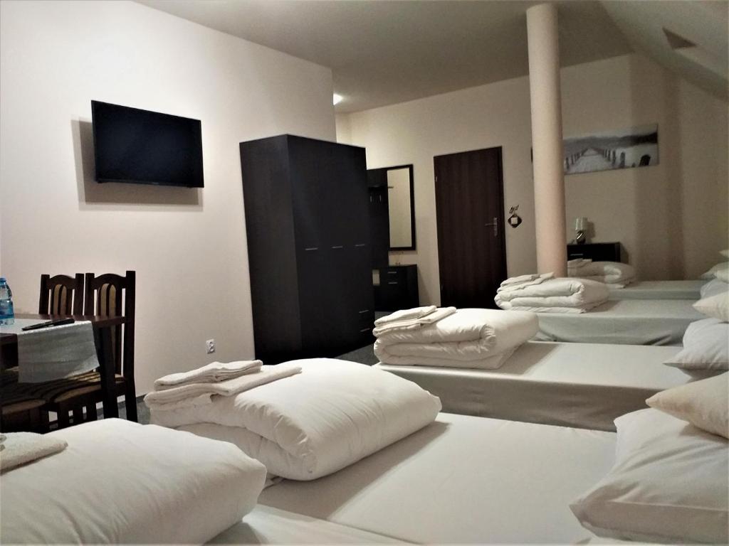 Posteľ alebo postele v izbe v ubytovaní Sum Restauracja & Hotel