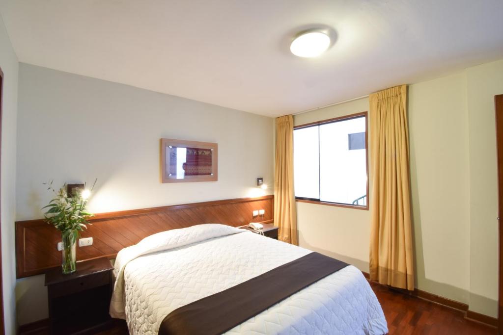 Postel nebo postele na pokoji v ubytování Hotel Señorial
