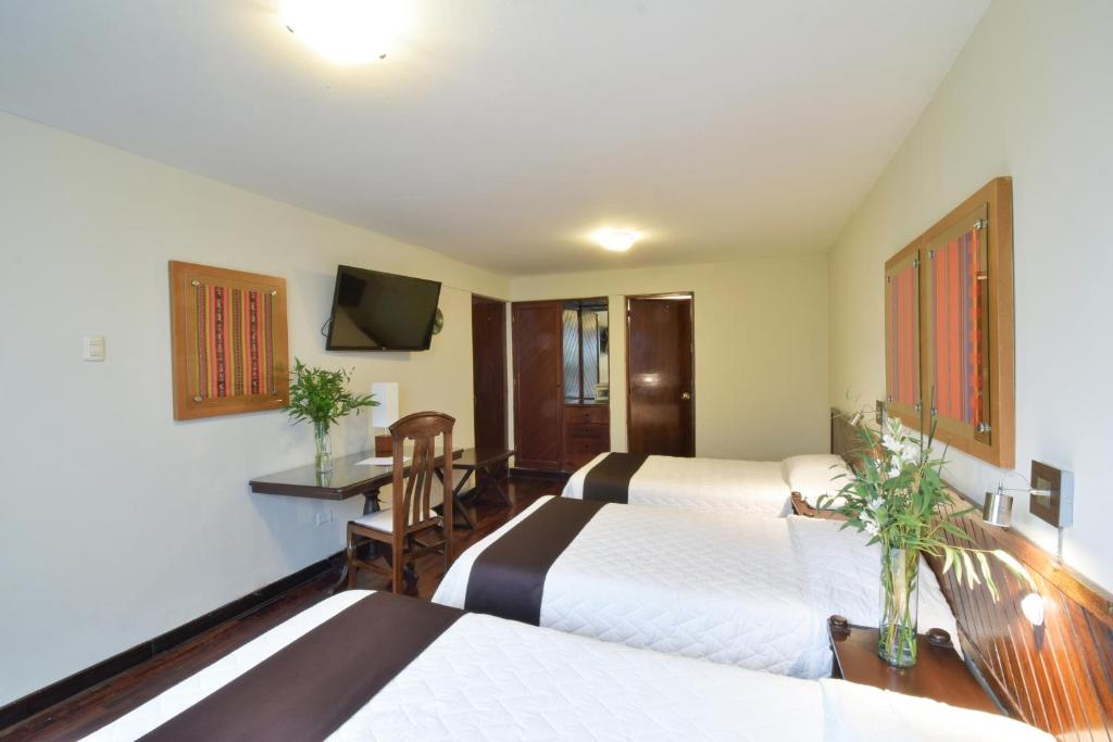 Postel nebo postele na pokoji v ubytování Hotel Señorial