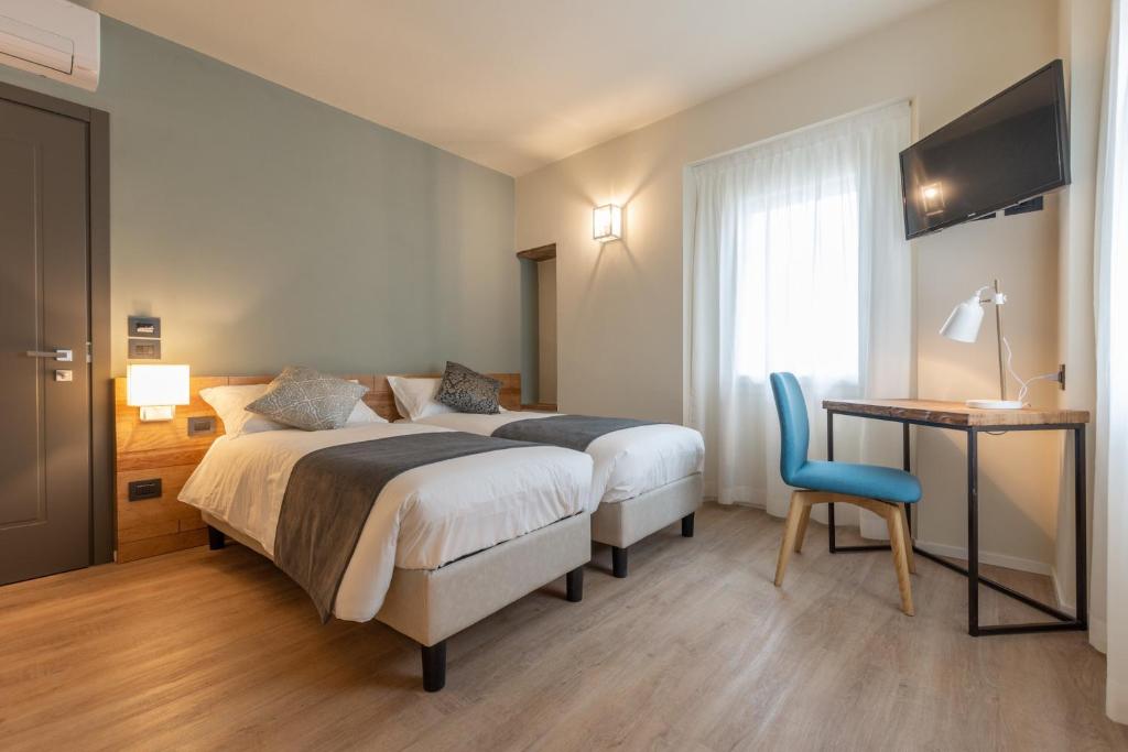 A bed or beds in a room at Borgopetra