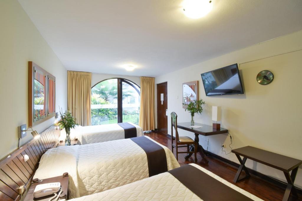 Postel nebo postele na pokoji v ubytování Hotel Señorial