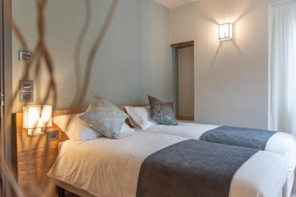 A bed or beds in a room at Borgopetra
