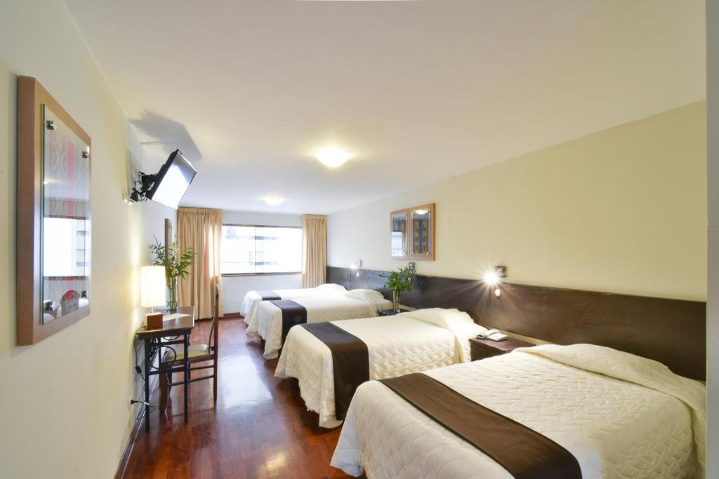Postel nebo postele na pokoji v ubytování Hotel Señorial
