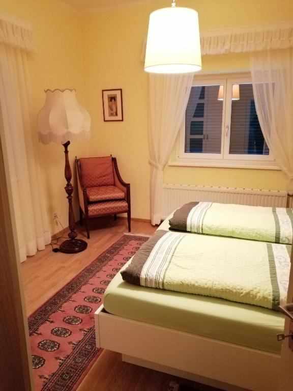 Postel nebo postele na pokoji v ubytování Villa Siebenruh