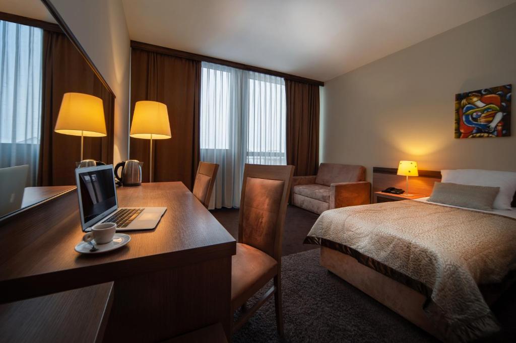 Voodi või voodid majutusasutuse Hotel Kras toas