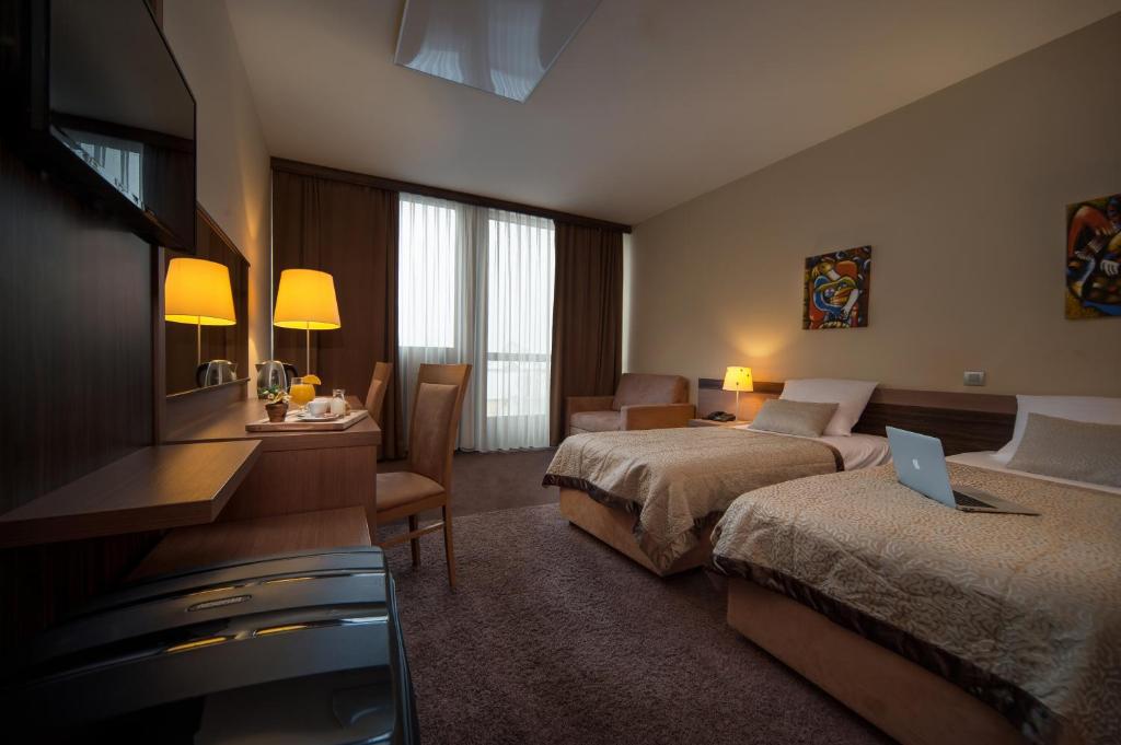 Voodi või voodid majutusasutuse Hotel Kras toas