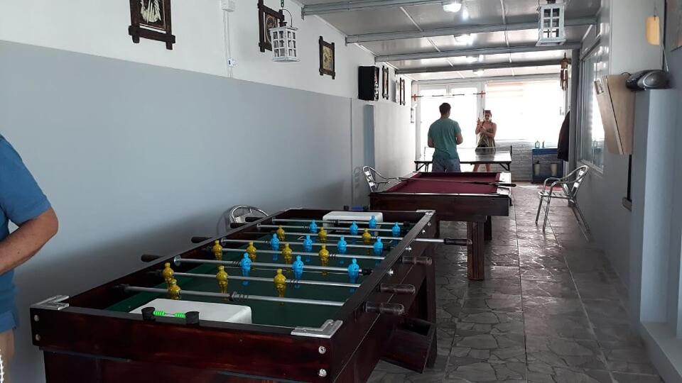 a room with several pool tables in a room at Terrazas De Punta Colorada in Piriápolis