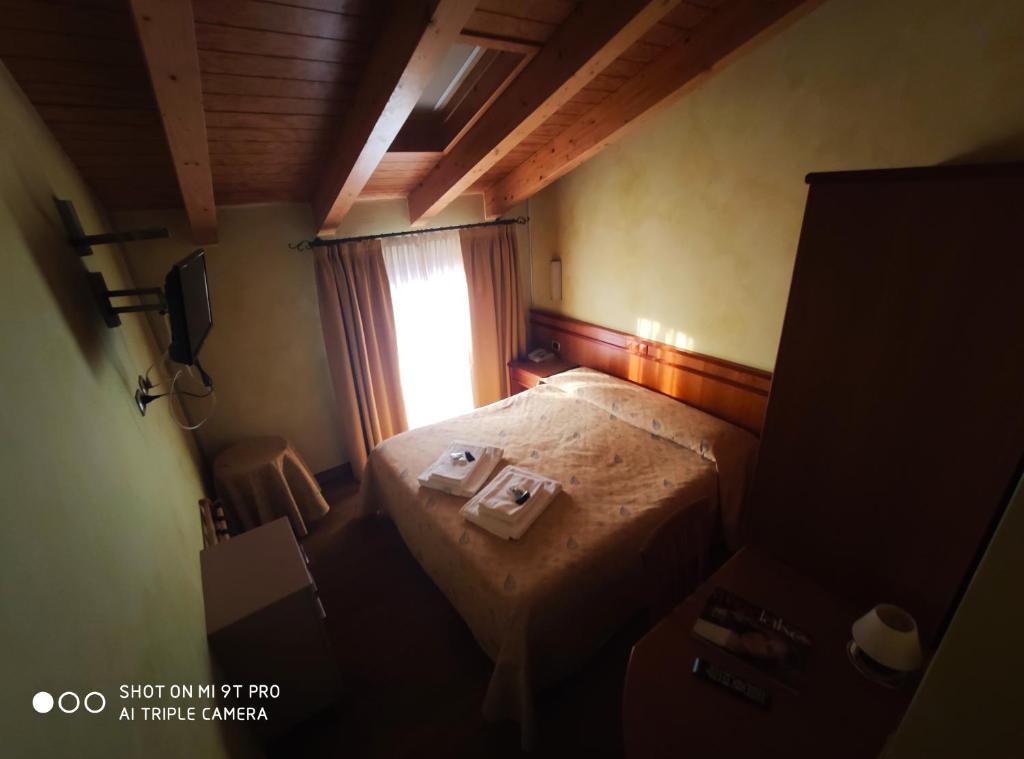 Postel nebo postele na pokoji v ubytování Azzano Holidays B&B