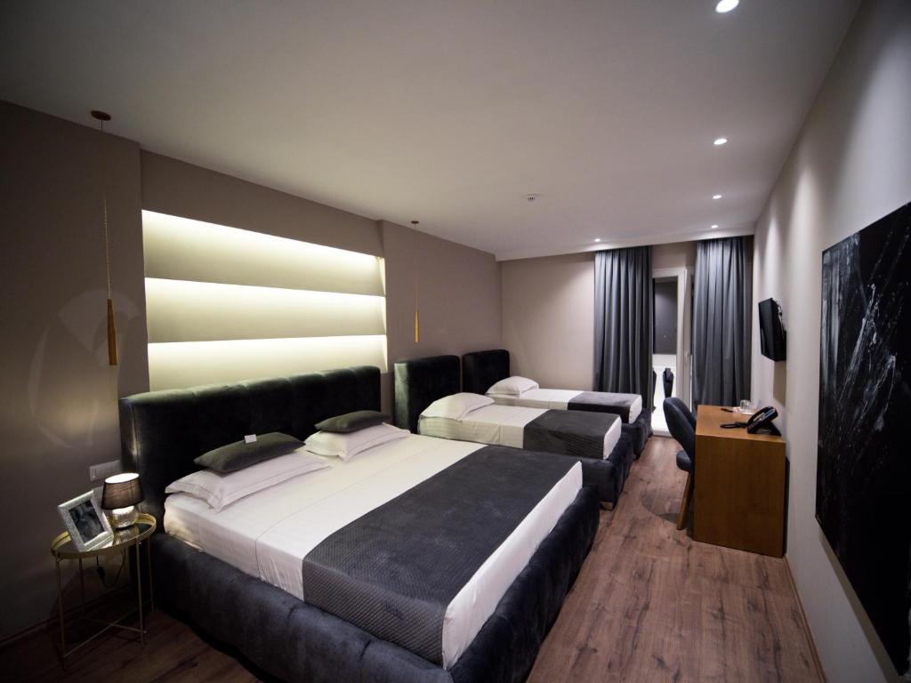 Postel nebo postele na pokoji v ubytování Light Hotel