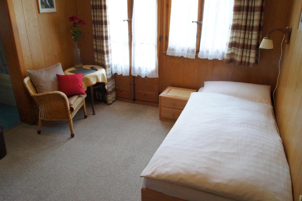Postel nebo postele na pokoji v ubytování Hotel Alpina