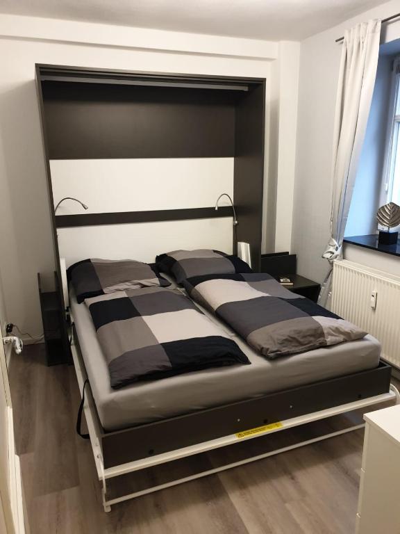 Postel nebo postele na pokoji v ubytování Strandallee 150a