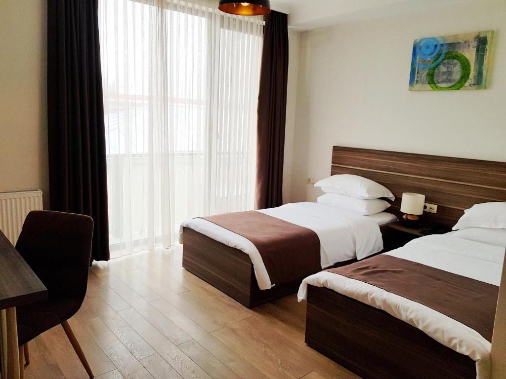 Postel nebo postele na pokoji v ubytování Mount Inn Kazbegi