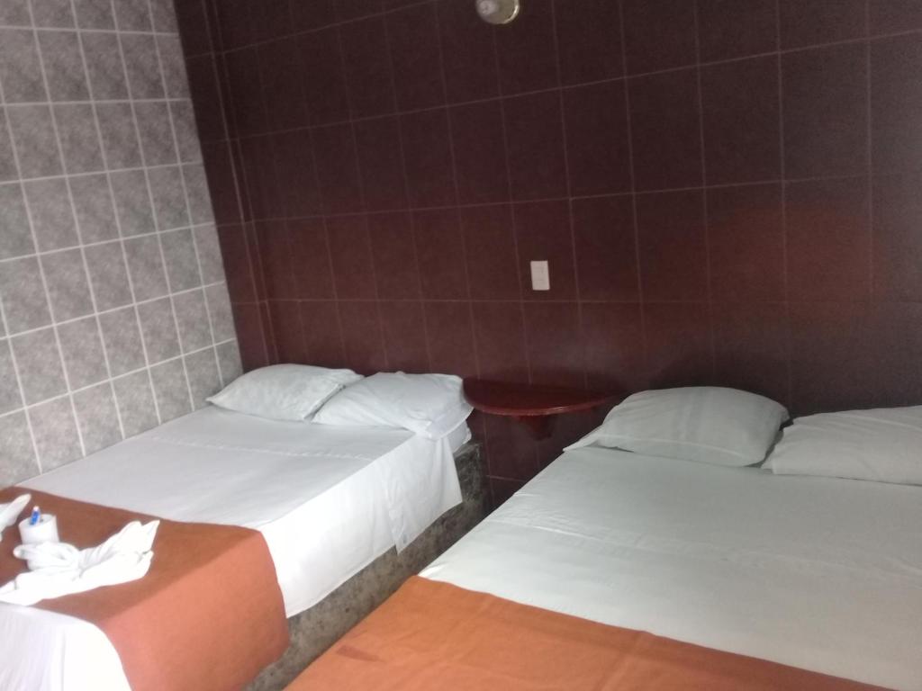 Postel nebo postele na pokoji v ubytování Hotel Naj Kin