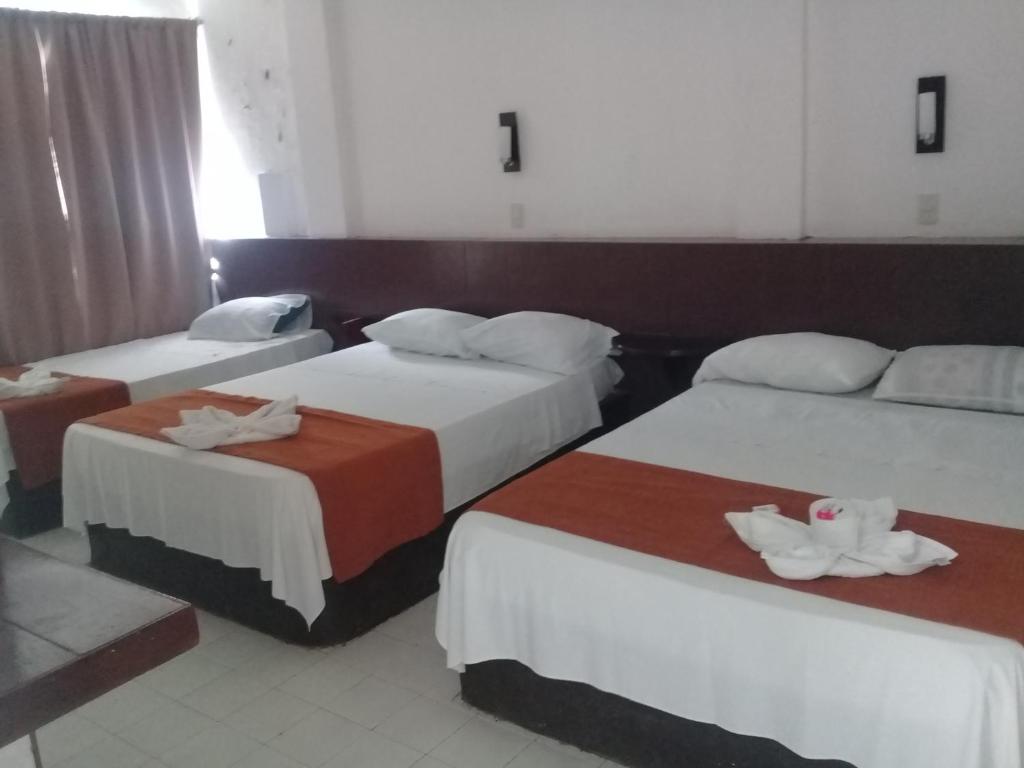 Postel nebo postele na pokoji v ubytování Hotel Naj Kin