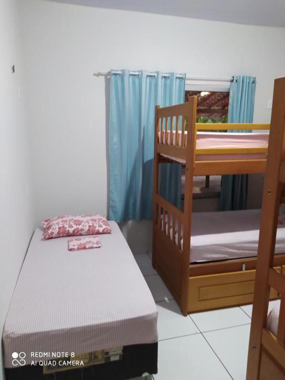 Postel nebo postele na pokoji v ubytování Hostel Lençóis Park