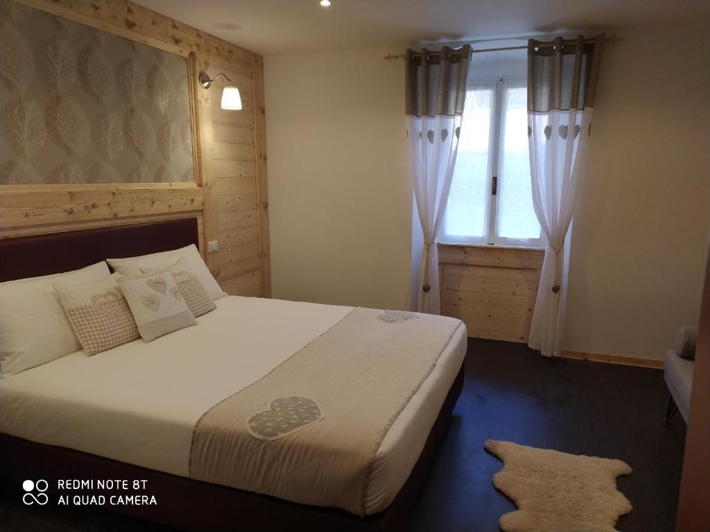 Posteľ alebo postele v izbe v ubytovaní Ledro Lake Suite "Pur"