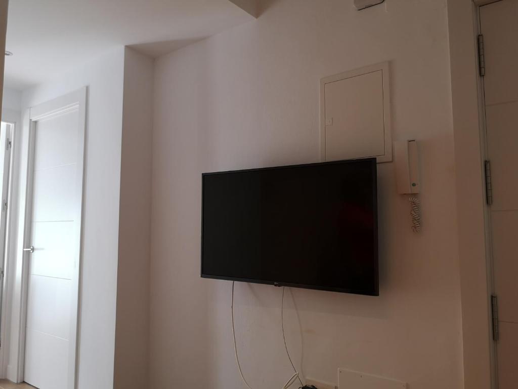 Televízia a/alebo spoločenská miestnosť v ubytovaní Apartamento Málaga 2 dormitorios - ARAMAR
