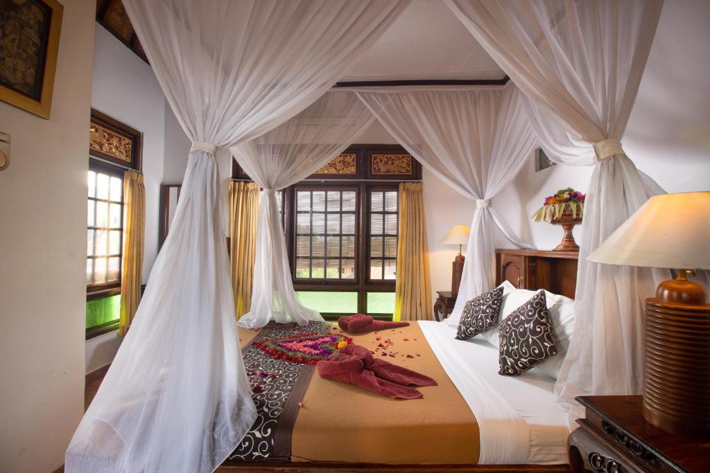 Postel nebo postele na pokoji v ubytování Ketut's Place Bed & Breakfast Ubud