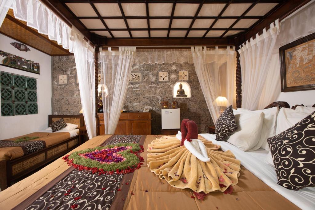 Postel nebo postele na pokoji v ubytování Ketut's Place Bed & Breakfast Ubud