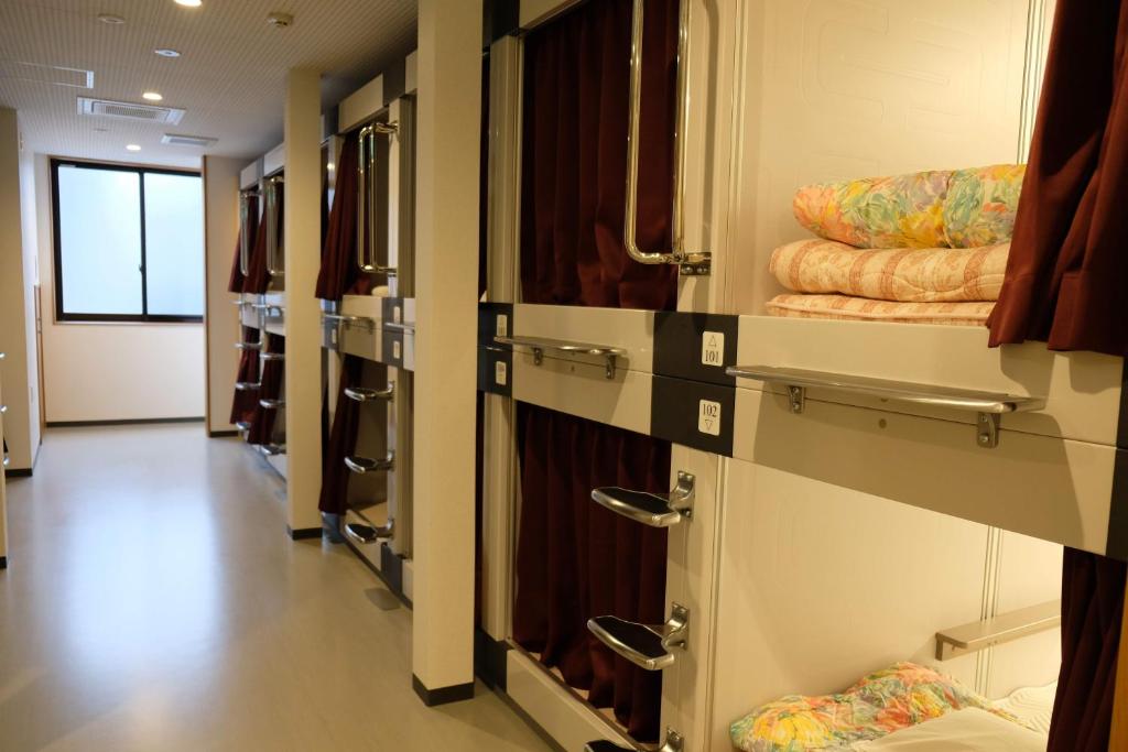 Postel nebo postele na pokoji v ubytování 大田市ゲストハウス 雪見院 Guesthouse Yukimi-inn
