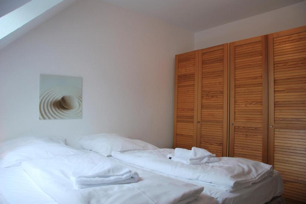 Postel nebo postele na pokoji v ubytování Haus Heidehof Whg. 17