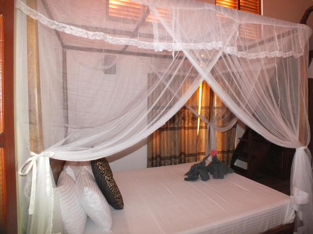 Letto o letti in una camera di Abraham Beach House