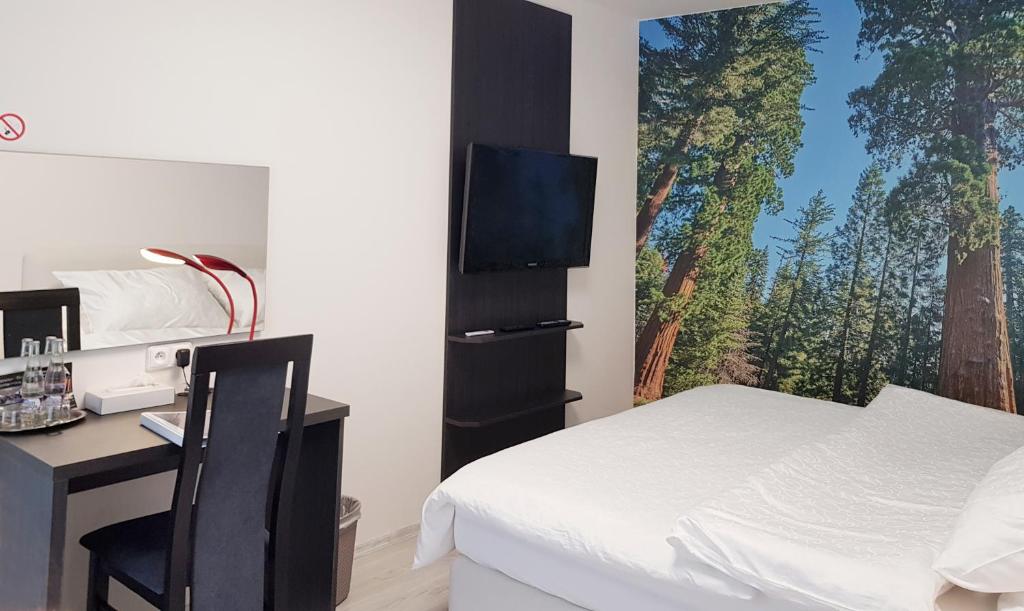 Postel nebo postele na pokoji v ubytování Restaurace a hotel Amerika